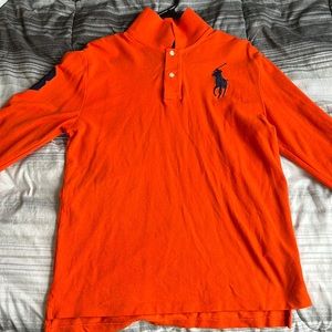 This is a XL(18-20) orange polo long sleeve shirt still in good condition